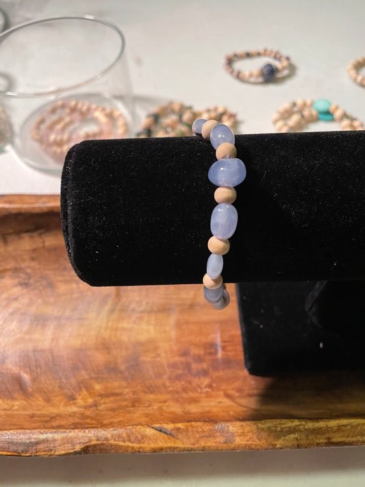 Lavender colored plastic and wood bead bracelet